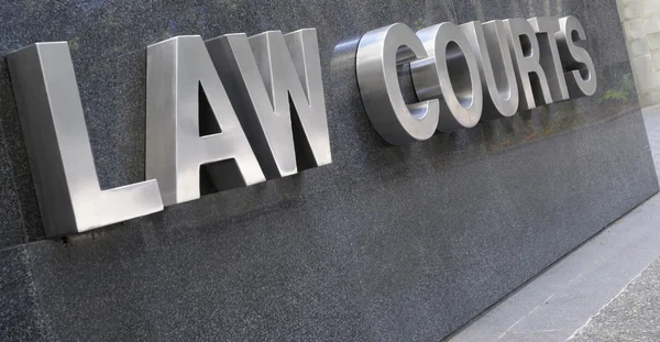 Law Courts sign in stainless steel — Stock Photo, Image