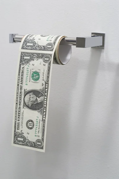 Dollar bills in the form of a roll of toilet paper — Stock Photo, Image