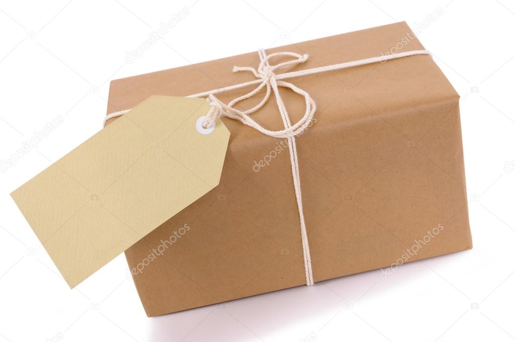 Brown paper package with white string and tag