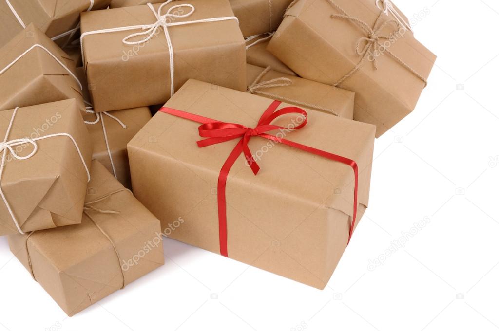 Group of parcels, one with red ribbon