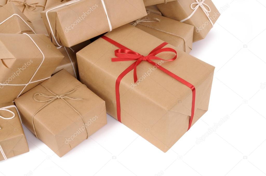 Group of parcels, one with red ribbon