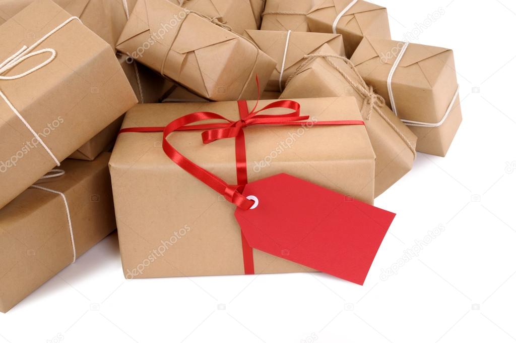 Group of parcels, red gift tag
