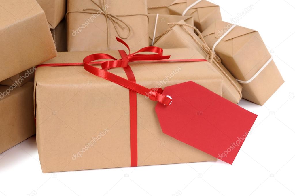 Group of parcels, red gift tag
