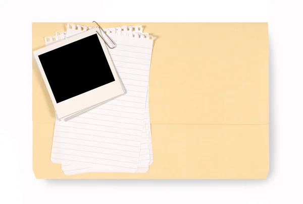 Office folder with untidy note paper and blank polaroid — Stock Photo, Image