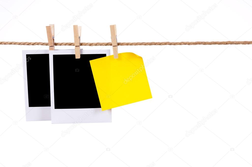 Blank photo prints and sticky note on a rope