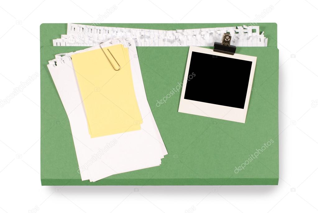 Office folder with untidy note paper and blank polaroid