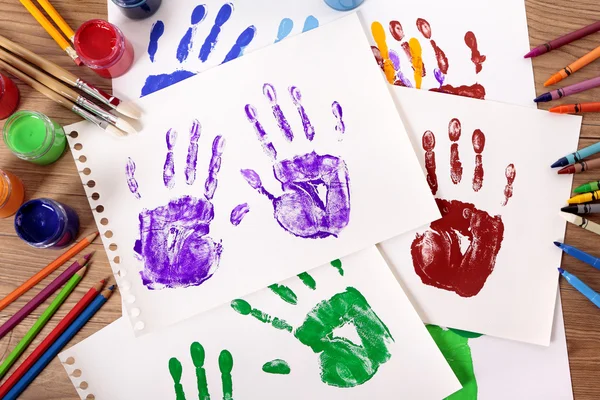 Handprints and art equipment — Stock Photo, Image