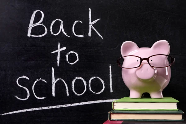 Piggy Bank with back to school message — Stock Photo, Image