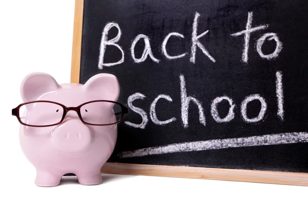 Piggy Bank com mensagem de volta à escola — Fotografia de Stock