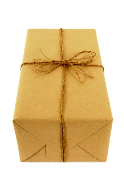 Brown paper package tied with string — Stock Photo, Image