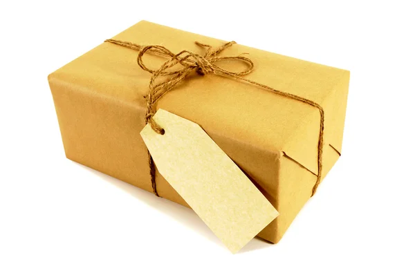 Brown paper package tied with string — Stock Photo, Image