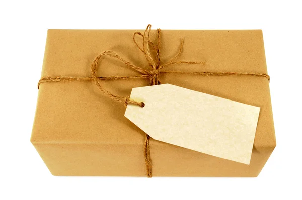 Brown paper package tied with string — Stock Photo, Image