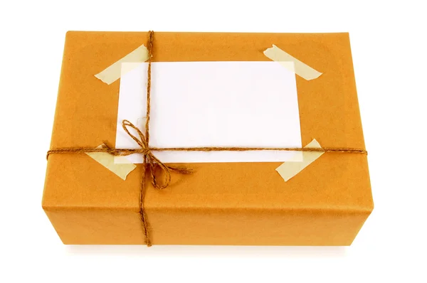 Brown paper package with address label Stock Photo