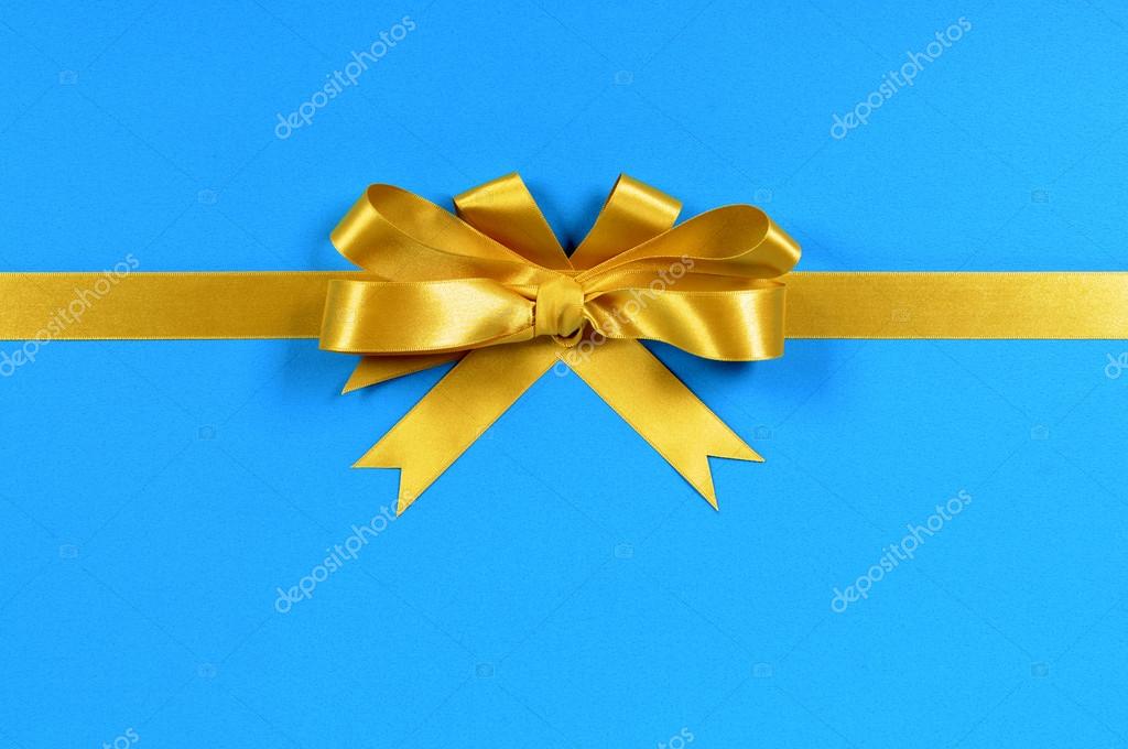 Gold ribbon on blue background Stock Photo by ©david_franklin 83813842