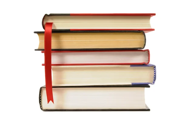 Small stack of hardback books with bookmark ribbon isolated on white — Stock Photo, Image