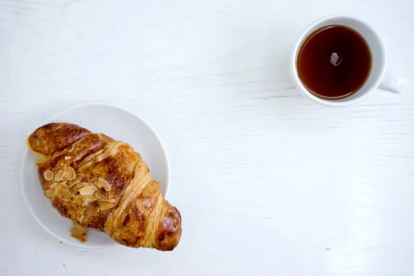 Croissant cup coffee white table — Stock Photo, Image