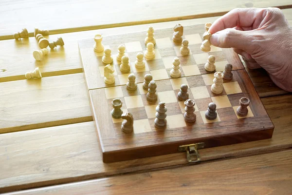 Small chess in hand — Stock Photo, Image