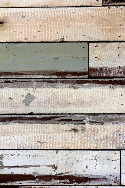 Textuur van oude verf stuk hout aan muur — Stockfoto