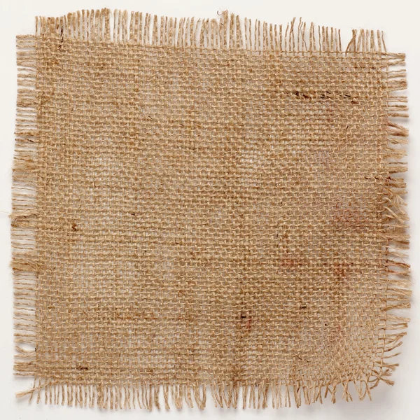 Texture of Burlap hessian square with frayed edges — Stock Photo, Image