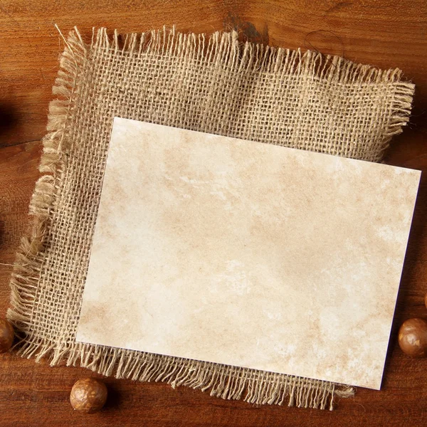 Paper burlap on teakwood board — Stock Photo, Image