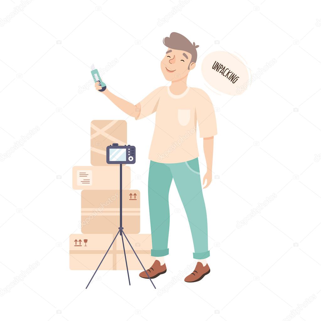 Blogger Guy Unpacking Parcels Online, Male Influencer Unboxing Purchase Recording Video with Camera on Tripod Cartoon Style Vector Illustration