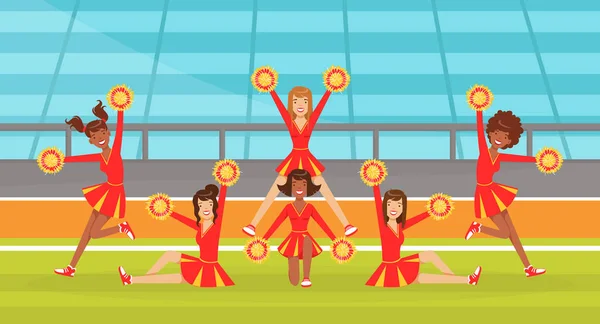 Roztleskávačky Team Dancing Together with Pom Poms, Fans Girls in Red Uniform Performing on Football Stadium Outdoors Vector Illustration — Stockový vektor