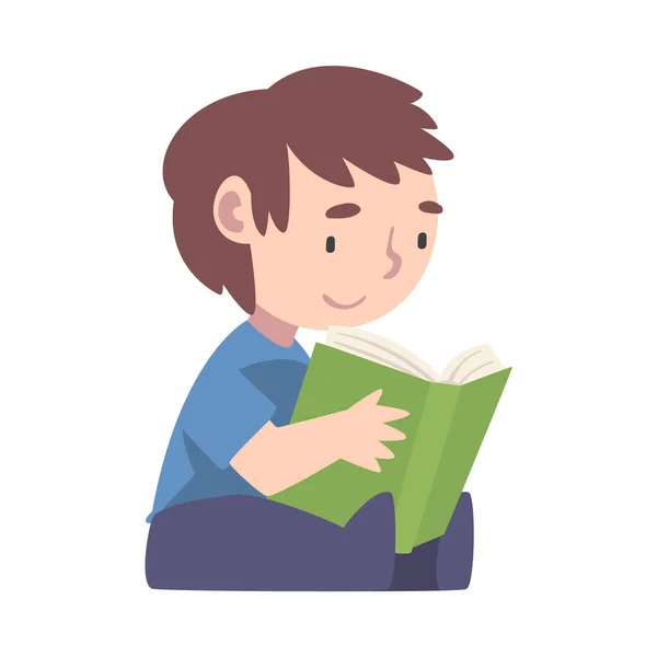 Jongen Zittend op de vloer en Lezen, Schattig Kind Genieten van Literatuur, Basisschool Student Karakter Cartoon Style Vector Illustratie — Stockvector