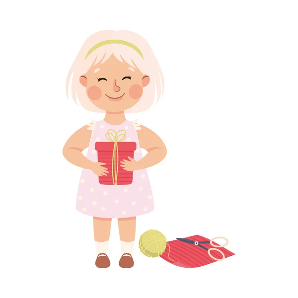 Little Blond Girl w swoim dzieciństwie gospodarstwa opakowane pudełko Wektor ilustracji — Wektor stockowy