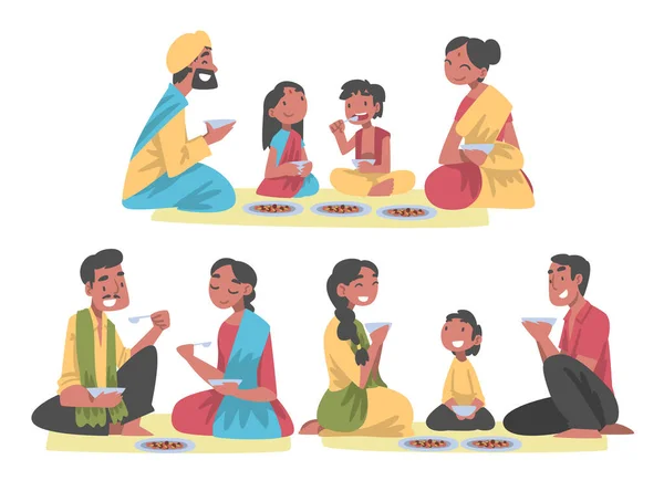 Indiaas gezin met kleine kinderen zitten op de vloer having Meal Together Vector Set — Stockvector