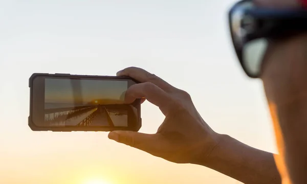 Man Glasses Taking Photo Mobile Phone Sunset Light — Stock Photo, Image