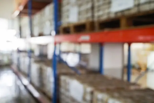 Blur shelves of documents in storage room.