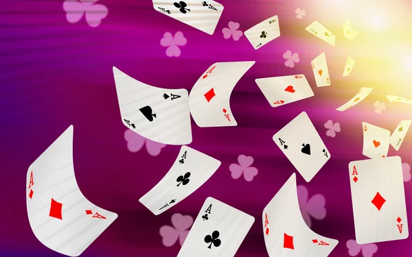 Playing cards falling on a pink background — Stock Photo, Image