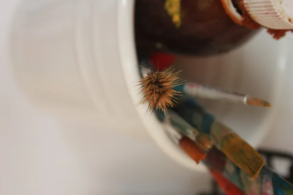 Oil painting artist brushes on a white bucket. — Stock Photo, Image