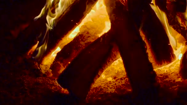 Wooden boards stacked in the fire and burning — Stock Video