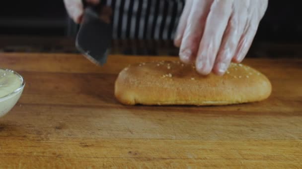 Hands of Chef Cuts Baguette by Knife — Stock Video