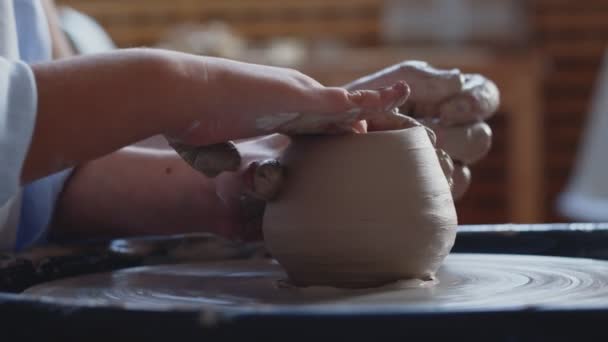 Close up of a little boy in a pottery class. — Stock Video