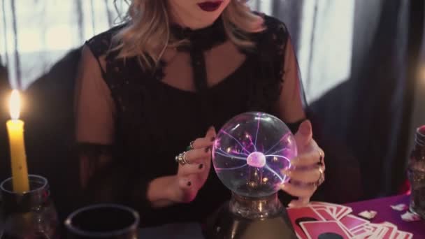 Close up of fortune teller performing ritual and crystal ball foreseeing future — Stock video