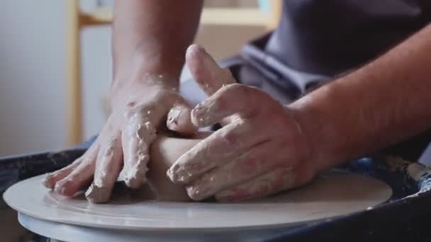 Hand work on pottery wheel, shaping a clay pot — Stock Video