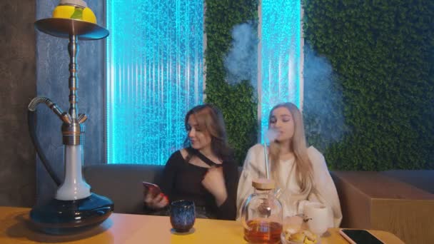 Two the best girlfriends takes selfie together in hookah bar — Stock Video