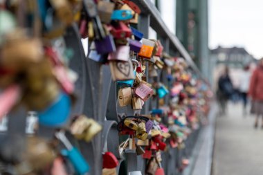 Padlocks on the Love Lock Bridge (Eiserner Steg, Iron Bridge) in Frankfurt am Main, Germany, having various names of love couples engrained in them