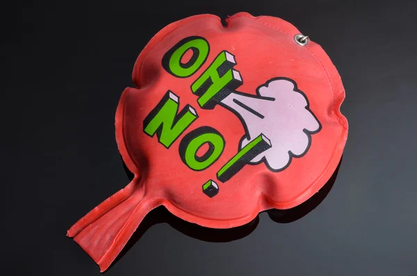 Red whoopee cushion with reflection on black glass — Stock Photo, Image