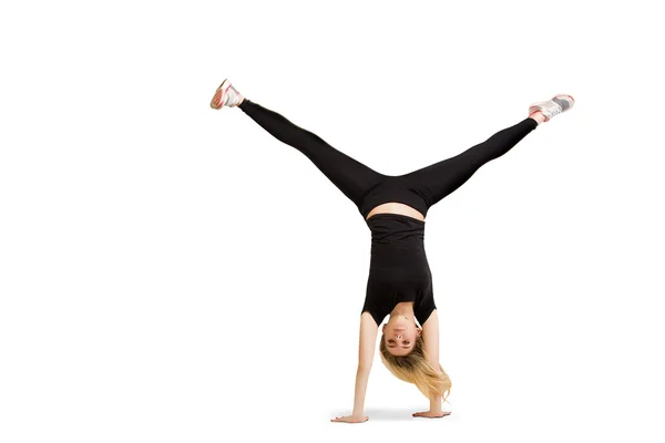 Caucasian woman doing cartwheel isolated on white — 图库照片