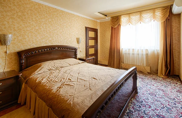 Vintage classic hotel golden bedroom interior