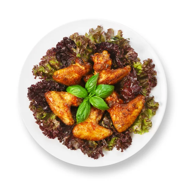 Fried roasted chicken wings on lettuce — Stock Photo, Image