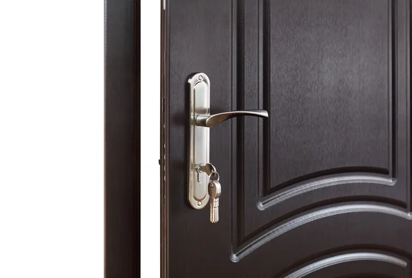 Closed dark brown wooden door handle with lock. — Stock Photo, Image