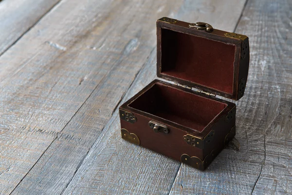 stock image Wooden chest or trunk at serenity wood background