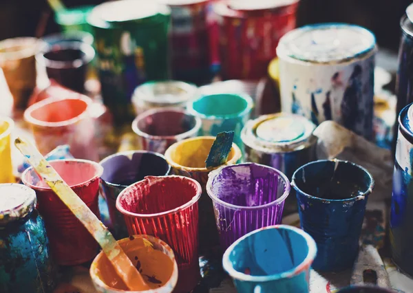 multicolored cans with paint, arts background