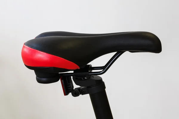 Closeup of a bicycle saddle at the white background — Zdjęcie stockowe