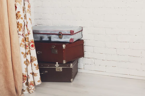 Vintage suitcases pile indoors, travel concept. — Stock Photo, Image