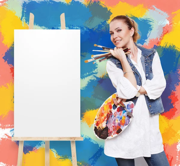 Woman artist with brushes, palette and copy space — Stock Photo, Image